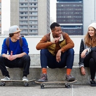 Three teens eating KitKat Chunky bars