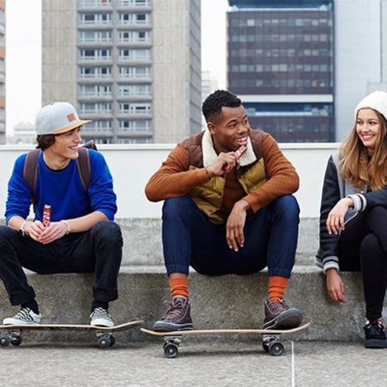 Three teens eating KitKat Chunky bars